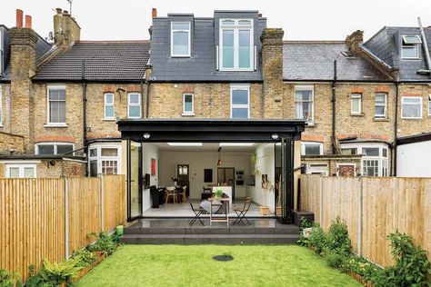 A single-storey rear extension to this terraced house in Wimbledon has created an open-plan kitchen-living-diner. Planning permission was sought for a 4m-long design with bi-fold doors and skylights. | #homedesign #interiorinspo #renovation #homedecorideas #dreamhome #homeremodel #interiordesign #kitchenextension #singlestorey #kitchenextensions #kitcheninspo #dreamkitchen #kitchendecor #crittallstyle #crittalldoor #glazing #storageideas #stoarge #kitchenstorage #kbbmag Extension Ideas Open Plan, Victorian Terrace Kitchen Extension, Terrace Kitchen Extension, Victorian Terrace Kitchen, Rear Kitchen Extension, Wraparound Extension, Flat Roof Tiles, Single Storey Rear Extension, Types Of Kitchen