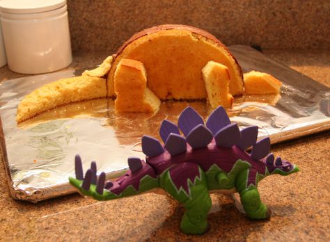 Dinosaur Cut Up Cakes | next i used my son’s dinosaur toy as a model and began carving the ... Stegosaurus Cake, Dino Cake, Dinosaur Birthday Cakes, Dinosaur Themed Birthday Party, 4th Birthday Cakes, Boxed Cake, 3rd Birthday Cakes, Dug Up, Dinosaur Cake