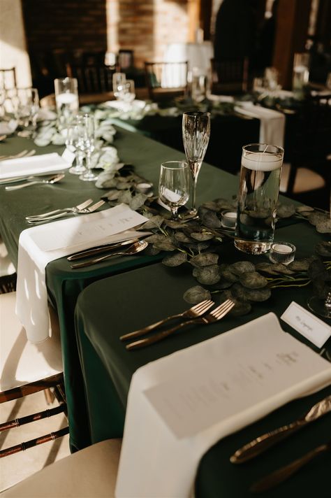 Layne and Francis celebrated a gorgeous winter wedding, which featured hunter green and ivory linens with gold accents ✨ Hunter Green Linens Wedding, Green Ivory And Gold Winter Wedding, Hunter Green Table Cloth Wedding, Dark Green Table Cloth Wedding, Dark Green Wedding Table Settings, Emerald Green Wedding Decorations Centerpieces Table Settings, Forest Green And Beige Wedding, Wedding Green Tablecloth, Black And Gold Wedding Tables