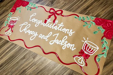 Such a simple and elegant banner design!! I love! ❤️🥂🫶🏼 #banner #banners #bannerdesign #brownpaperbanner #painting #shopsmall #smallbusiness #roses #red #drinks Holiday Banner Design, Parade Banner Ideas, Hand Painted Banner Ideas, Christmas Banner Painted, Painted Christmas Banner, Christmas Painted Banner, Painted Banner Ideas, Frat Wedding, Gameday Banner