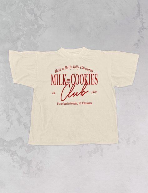 Join the Milk & Cookies club for everyone's favorite season, Christmas, in this super cozy oversized tshirt!- Features the phrase "Milk and Cookies Club, est. 1870" with "Have a Holly Jolly Christmas" above & "it's not just a holiday, it's Christmas" below all in red or white ink- Screen print transfer that is individually heat pressed onto each tshirt- Printed on a soft vintage wash tshirt, that gets softer with each wash- Oversized fit- 100% Cotton- Sizing translation: XS/S - L , S/M - XL , L/ Italian T Shirts, Holiday Tshirt Designs, Staff Shirt Design, Fall T-shirt, Minimal Merch Design, Vintage Sports Tshirt, Christmas Graphic Tee, Christmas T-shirts, Club Shirt Designs