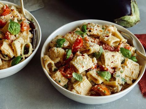 Recipe of the Day: Summer Pasta with Grilled Eggplant Sauce 😍 This recipe takes advantage of the fact that the flesh of grilled eggplant transforms into a luscious creamy sauce that’s perfect for dressing up little tubes of rigatoni. To make the most of summer’s bounty, grill cherry tomatoes alongside the eggplant until bursting with juices, then mix them into this easy pasta dinner. Chicken Kelaguen, Copycat Zuppa, Eggplant Sauce, Guacamole Salad, Eggplant Pasta, Charred Corn, Lime Sorbet, Pork Schnitzel, Baked Feta