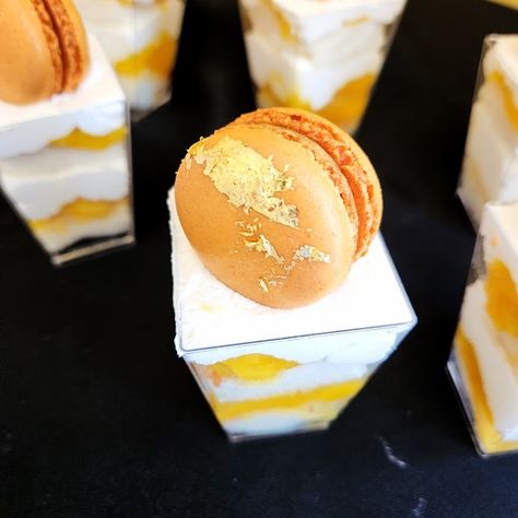 Delightful dessert shooters! From fruity flavors to decadent chocolate, there's something for everyone. Pictured here are our exquisite mango dessert shooters, topped with a luxurious mango and gold flake macaron. Perfect for easy setup and self-serve fun, these treats are sure to impress your guests and make hosting a breeze. 🌞🍰 #SummerTreats #DessertShooters #PartyIdeas #SelfServe #EasyHosting #MangoMagic #SweetDelights #SummerParties #DessertLovers #PartyPlanning #celenesconfections #down... Dessert Shooters, Mango Dessert, Gold Flake, Self Serve, Sweet Delights, Decadent Chocolate, Summer Treats, Summer Parties, Macarons