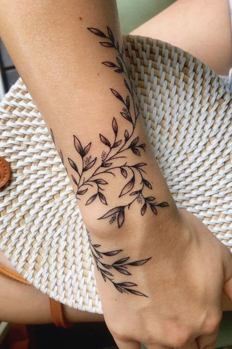 Wraparound Flowers Tattoo 
#WraparoundTattoo #InkInspiration #TattooArtistry #BodyArt #InkedLife #TattooIdeas #TattooTrends #CreativeInk #ArtisticTattoos #TattooLove #DesignInk Arm Wrap Tattoo, Flower Vine Tattoos, Wrap Around Wrist Tattoos, Tato Tradisional, Wrap Around Tattoo, Around Arm Tattoo, Wrap Tattoo, Inspiration Tattoos, Vine Tattoos