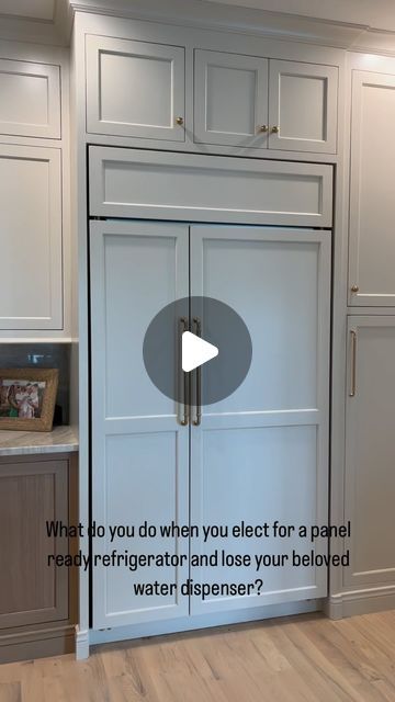 Marisa MW on Instagram: "We drink a lot of water in our house, so when we elected for a panel ready refrigerator, one of my first thoughts was “What about water dispensing?” I didn’t want to constantly stare at a filtered water pitcher on the counter, so I came up with the idea to hide one inside of the cabinetry. We had the cabinet maker spec this vertical cabinet to fit the #elkay dispenser I had purchased and went from there. The plumber team who installed it definitely used some choice words during the process 🤣 They said they’ve never seen one of these installed inside of a cabinet before…Leave it to me 🙃 but we couldn’t be happier with it.   #interiordesign #kitcheninspiration #kitchenrenovation #kitchendesign #kitchenfeatures #elkay" Elkay Water Dispenser, Water Cooler In Pantry, Water Dispenser Cabinet, Built In Water Dispenser Cabinet, Water Cooler Cabinet Ideas, Refrigerator Cabinet Ideas, Water Dispenser Ideas Kitchens, Panel Fridge, Water Dispenser Cabinet Ideas