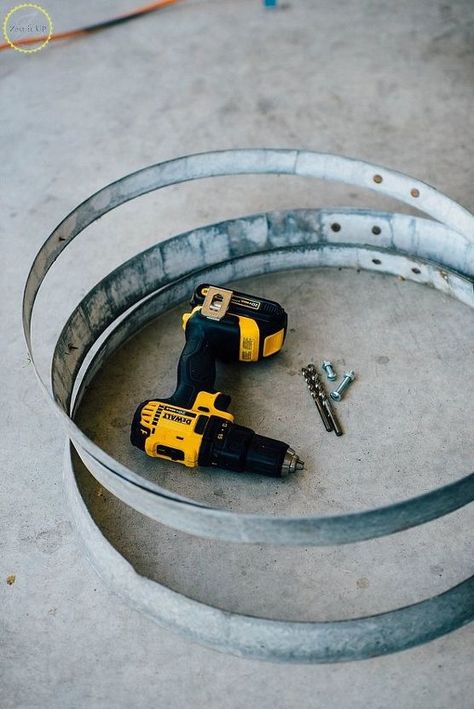 Here is a fun and easy craft to add some zest to your garden (or really anywhere in your home). Simply grab some old wine barrel rings and you can add some industrial rustic edge to your space. I snagged these rings at the swap meet for pretty inexpensive but you can also find them online on Craigslist pretty often too. You can even buy a wine barrel and that is a whole barrel of crafts that will certainly keep you busy!! I made a few of these and placed them around the entry to our ho… Wine Barell Rings, Wine Barrel Garden, Wine Barrel Coffee Table, Furniture Recycling, Barrel Art, Wine Barrel Rings, Barrel Ring, Garden Spheres, Garden Globes