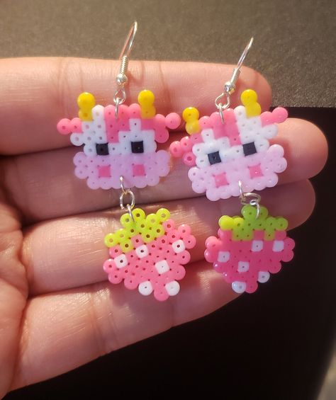 Cottagecore inspired, cute strawberry cow perler earrings! Absolutely darling and fun!  The second picture shows my larger ones to compare in size with. Cute Perler Bead Earrings, Earring Perler Beads, Easy Perler Bead Ideas Simple, Pearled Bead Earrings, Cute Perler Patterns, Kandi Perler Ideas, Fun Perler Bead Ideas, Pig Perler Beads, Cow Perler Beads