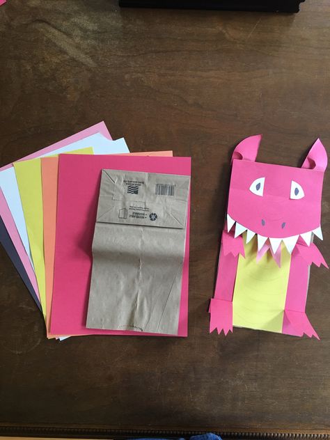 Chinese Dragon puppet made with brown paper bag, construction paper and stick glue. Dragon Paper Bag Puppet, Chinese Dragon Puppet, Bag Puppet, Bag Construction, Diy Preschool, Paper Bag Puppets, Birthday Countdown, Puppet Making, Dragon Puppet