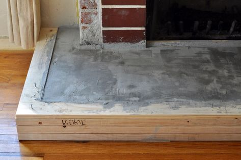 Concrete fireplace hearth DIY Fireplace Hearth Ideas, Airstone Fireplace, Hearth Ideas, Hearth Stone, Fireplace Update, Wooden Fireplace, Brick Fireplace Makeover, Candles In Fireplace, Concrete Fireplace