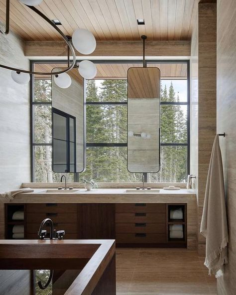 ATLANTA INTERIOR DESIGNER on Instagram: "How about this primary bath with a gorgeous Park City mountain view? A luxury bathroom suite with all the finishing touches, like those incredible ceiling-mounted mirrors to maximize the view. ⁣​​​​​​​​ ⁣​​​​​​​​ Architecture: @thruxtoneric @ankeny_wyo⁣​​​​​​​​ Interiors: @CLB Architecture + The Illuminus Group⁣​​​​​​​​ Styling: @_jenpaul @keyandmoondesigns⁣​​​​​​​​ Photography: @k7scott⁣​​​​​​​​ Via: @carriedelanyinteriors⁣​​​​​​​​ ⁣​​​​​​​​ ⁣​​​​​​​​ ✨ Travertine Bathroom Design, Elegant Bathroom Decor Ideas, Wood Tub, Elegant Bathroom Decor, Floating Fireplace, Primary Suite, Suite Bathroom, Ski House, Showroom Interior Design