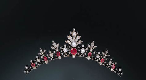 An Attractive Antique Diamond and Ruby Necklace forming Tiara  Composed of a graduated stylised line of buds and leaves with ruby collet detail with central pear-shaped and cushion-shaped diamond palmette design drop, mounted in silver and gold, with later mesh link bank chain and tiara frame, circa 1880, 15.7cm. long Ruby Tiara, Princess Stuff, Vintage Tiara, Tiaras Jewellery, Royal Tiaras, Beautiful Tiaras, Diamond Tiara, Ruby Necklace, Royal Jewels