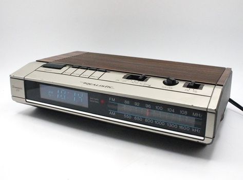 Vintage 1980s digital alarm clock am/fm radio blue light lit LED time display mod woodgrain silver case Chronomatic 253 Realistic by deckvintage on Etsy Cassette Futurism, Fm Radio Receiver, Mod Design, Small Clock, Retro Gadgets, Classic Camera, Clock Radio, Radio Alarm Clock, Palm Bay