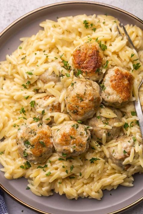 "An enticing image featuring Chicken Meatballs served on a bed of creamy Garlic Parmesan Orzo, a flavorful and comforting dish." Chicken Meatballs And Risotto, Crockpot Garlic Butter Chicken Meatballs With Orzo, Chicken Meatball Gnocchi, Swedish Meatball Orzo, Instant Pot Chicken Meatballs, What To Make With Chicken Meatballs, Store Bought Meals, Chicken Meatball Casserole, Healthy Meatball Dinner