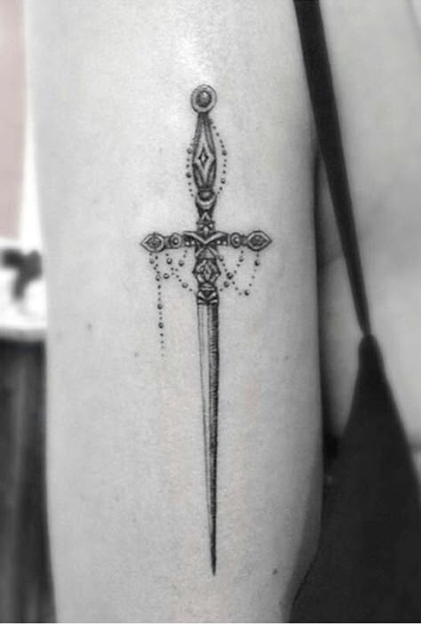 210+ Best Sword Tattoo Designs With Meanings (2022) - TattoosBoyGirl Christian Sleeve Tattoo, Inspiration Tattoos, Dagger Tattoo, Sternum Tattoo, Spine Tattoo, Tattoo Designs And Meanings, Spine Tattoos, Elegant Tattoos, Cross Tattoo