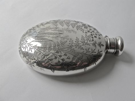 This silver hip flask is similar to the one Charlotte offers Chatham in The Devil Is a Marquess. Although this one is from 1867, its shape is common to many examples from the 18th and 19th centuries--including a concave curve to one side that allowed the user to wear it strapped comfortably to their hip or thigh. Hence the name "hip flask." --Elisa Braden (www.elisabraden.com) Hip Flask Aesthetic, Flasks Aesthetic, Cute Flask, Bridgerton Jewellery, Flask Aesthetic, High School Freshman, Silver Flask, Vintage Flask, Antique Perfume Bottles