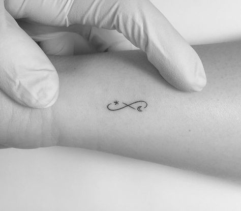 Infinity symbol with moon and star tattooed on the wrist Eternity Tattoo, Small Infinity Tattoos, Infinity Sign Tattoo, To The Moon And Back Tattoo, Tattoo Infinity, Infinity Tattoo On Wrist, Moon Star Tattoo, Infinity Symbol Tattoo, Infinity Tattoo Designs