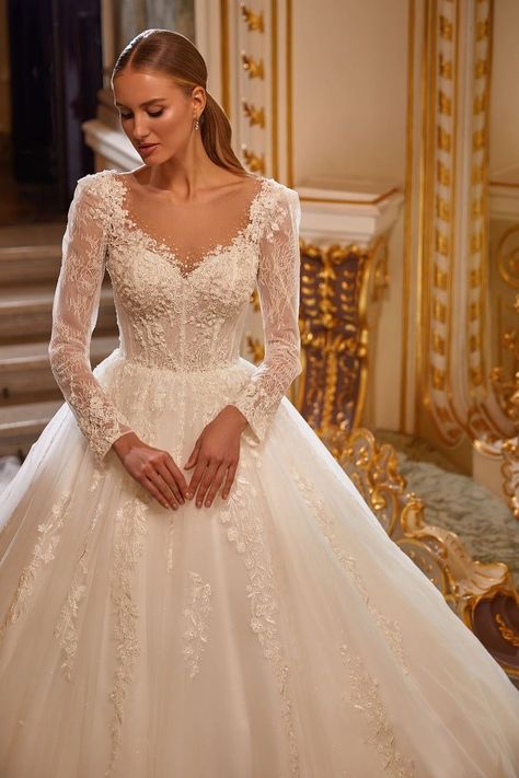 [PaidLink] You'll Forever Cherish The Moment You Take Your Special Someone's Breath Away In The Julian Long Sleeve Wedding Dress! We're In Love With This Stunning Bridal Gown With Long Sleeves And A Long Train. The Dress Is Lavishly Embellished With Floral Lace Appliques And Features A Highly Dramatic Corset With A Translucent Beaded Mesh Insert At The Neckline And Back. And A Long Impressive Cathedral Train Completes The Look And Makes It Even More Royal. #longsleevevintageweddingdress Romantic Princess Wedding Dress, Bride 2023 Dress, Catholic Wedding Dress Modest, Anna Sposa Wedding Dress, Catholic Bride Dresses, Bride Dress Winter, Winter Wedding Dress With Sleeves, Wedding Gown 2023, Full Sleeve Wedding Dress