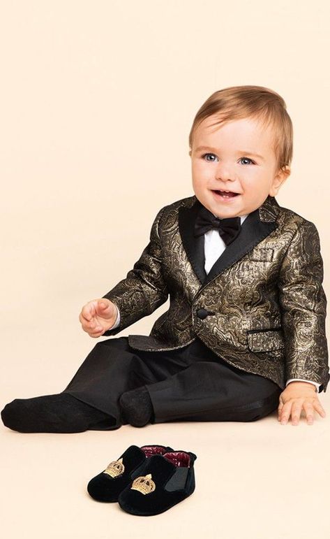 Cutie! Love this Dolce & Gabbana Baby Boys Gold Jacquard Blazer.  Perfect for a special occasion, this handsome baby blazer is made in a luxurious, metallic gold and black threaded jacquard cloth, by Italian brand Dolce & Gabbana. Makes a perfect ring bearer or pageboy outfit for baby boys at a Wedding! #dolcegabbana #babyboy #ringbearer #babyclothes #celebritybaby Pageboy Outfits, Boys Formal Wear, Kids Blazers, Tuxedo Mask, Colourful Prints, Blazer For Boys, Baby Boy Dress, Designer Baby Clothes