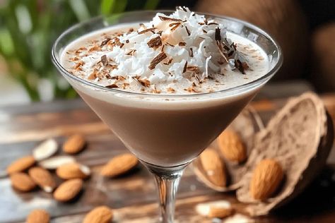 Indulge in a creamy Almond Joy Martini! This rich cocktail blends chocolate, coconut, and almond flavors for a luxurious dessert drink. Almond Joy Martini Recipe, Relaxing Drinks, Drink Of The Week, Martini Ingredients, Chocolate Martini, Herbalife Recipes, Cocktail List, Beet Recipes, Chocolate Liqueur