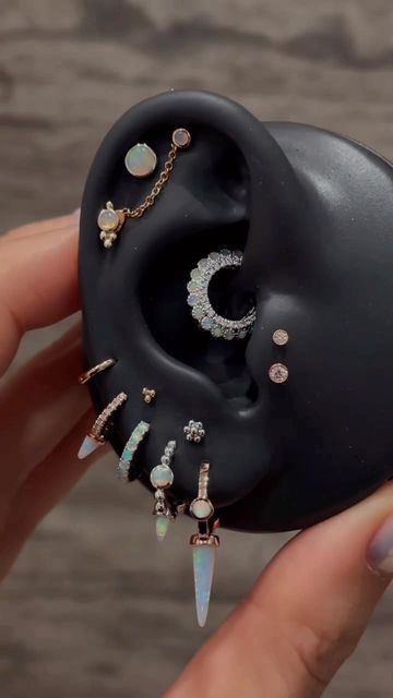 MARIA TASH on Instagram: "A kaleidoscope of opal styles from The Dubai Mall." Opal Earrings Aesthetic, Opal Earring Stack, Piercing Combos, Piercing Curation, Opal Piercing, Earring Aesthetic, Minimalist Ear Piercings, The Dubai Mall, Ear Curation