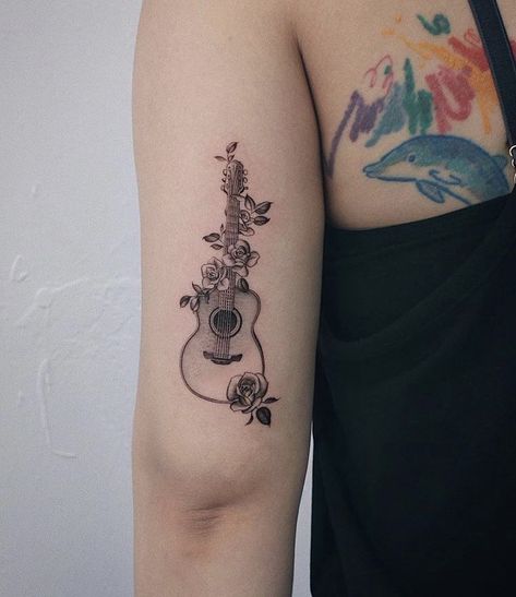 Pretty Guitar Tattoo, Guitar Butterfly Tattoo, Rose And Guitar Tattoo, Guitar With Roses Tattoo, Acoustic Guitar With Flowers Tattoo, Guitar And Piano Tattoo, Guitar Rose Tattoo, Feminine Music Tattoos, Ukulele Tattoo Ideas