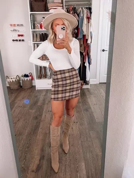 I’m in love with this plaid skirt + white bodysuit pair! Wearing a small in both! #fallboots #plaidskirt #datenightoutfit #hatstyle #fallstyle #falloutfit #miniskirt #fallskirt #ootd High Waisted Plaid Skirt Outfit, Plaid Skirt Boots Outfit, Thanksgiving Country Outfit, Fall Skirt Ideas Outfit, Flannel Skirt Outfits Winter, Plaid Skirt And Cowboy Boots, Friend Giving Outfits, Plaid Skirt With Boots, California Winter Fashion