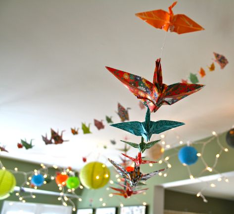 Paper cranes Hanging Cranes Origami Decoration, Japanese Themed Classroom, Origami Crane Garland, Origami Birthday Decoration, Origami Birthday Party, Paper Crane Garland, Japan Classroom Decor, Crane Garland, Birthday Sushi