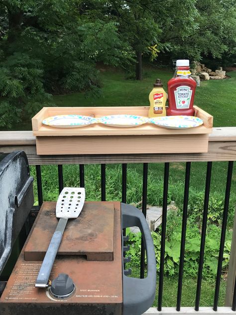 "Tired of not having room near your BBQ grill for all the items you need to cook with? This deck rail table helps to solve that issue. Made of 100% cedar, the Deck Railing Table will be made to order. It's made to fit over a standard 6\" deck rail. If needed, we can customize the width to accommodate a smaller or larger railing. The table can be stained to just about any color and clear coated to help protect it from the elements. Table will be 30\" long, 11.5\" wide and fits over a standard 6\" Cute Deck Decorating Ideas, Camper Deck Decorating Ideas, Deck Railing Table, Blackstone Table, Apartment Flip, Deck Gates, Small Deck Ideas, Railing Table, Bbq Deck