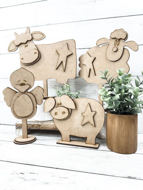 This everyday paint-your-own craft kit includes the mdf wood blank Set of 4 Farm Animals DIY Kit. Includes 1 Cow, 1 Sheep, 1 Pig, 1 Chick This barn animal craft cut out is the perfect craft night project for adult crafters and a great kids project idea.Use your creativity and to customize and personalize this blank DIY craft kit!This kit does not include paint, glue, brushes, or any additional embellishments to complete the Set of 4 Farm Animals DIY Kit. You will only receive the wooden craft ki Cow Wood Crafts, Diy Farm Animals Crafts, Craft Night Projects, Farm Animal Decor, Barn Crafts, Farm Animals Decor, Farm Animal Crafts, Farm Craft, Sheep Crafts