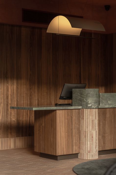 Lobby Desk Design, Art Gallery Front Desk, Mid Century Reception Desk, Japandi Reception, Information Desk Design, Self Check In Hotel, Hotel Lobby Reception Desk, Timber Reception Desk, Tambour Wood Reception Desk