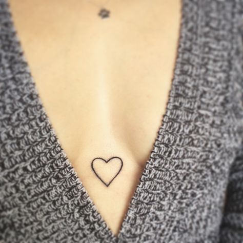 Heart sternum tattoo  Instagram @nichole_diaz11 Heart In Between Chest Tattoo, Heart On Chest Tattoo, Sternum Heart Tattoo Women, Heart Tattoo Sternum, Heart Tattoo On Chest Women, Heart Tattoo In Between Chest, Heart Tattoo On Chest, Heart Tattoo On Sternum, Hearts On Chest Tattoo