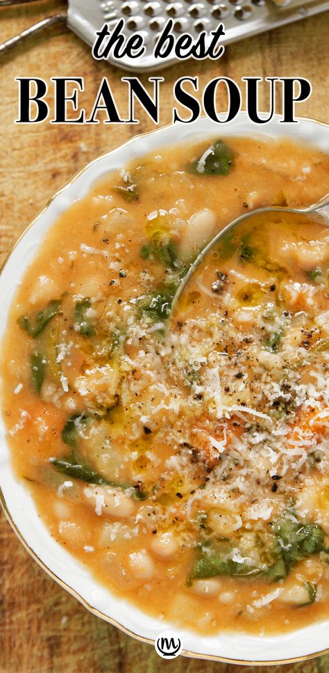 Top view of a white bowl full of white bean soup over a wooden background. Best Bean Soup Ever, Soup Recipes Bean, Portuguese White Bean Soup, White Bean And Lentil Soup, Cajun White Bean Soup, The Best White Bean Soup, Chicken Cannellini Bean Soup, Hearty Bean Soup Recipes, Spicy White Bean Soup