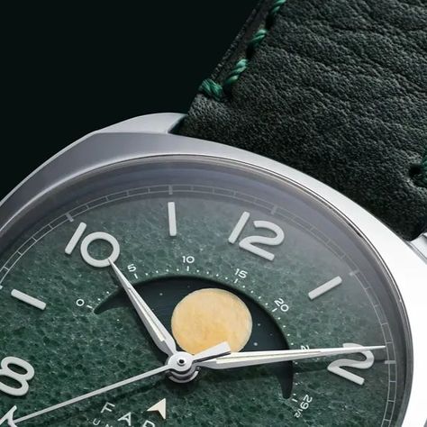 FARER on Instagram: "Meet the Baily.   Alongside the original three moonphase watches, we're excited to introduce you to a new special edition Moonphase with a dial made from authentic natural aventurine.   Typically aventurine seen in watchmaking is glass flecked with copper filings, this however, is a natural semi-precious gemstone that has been mined from the earth and painstakingly cut and polished.   The result is a dial that's just 1mm thick and which has a distinctive speckle-patterned look and a smooth glossy surface unique to each watch.   The watch will go on sale at 12:00 PM BST.  Only 200 units will ever be produced, with the first batch of 100 shipping in September.   Pricing for the watch is £1,725 / $1,925 / €1,925.  #farer #fareruniversal #farerwatches #moonphase #moonphase Green Watch With Polished Finish And Round Dial, Green Tachymeter Watch With Round Dial, Farer Watches, Evora Watches, Engagement Watch, Girard Perregaux Watches, Moonphase Watch, Moon Phases, The Original