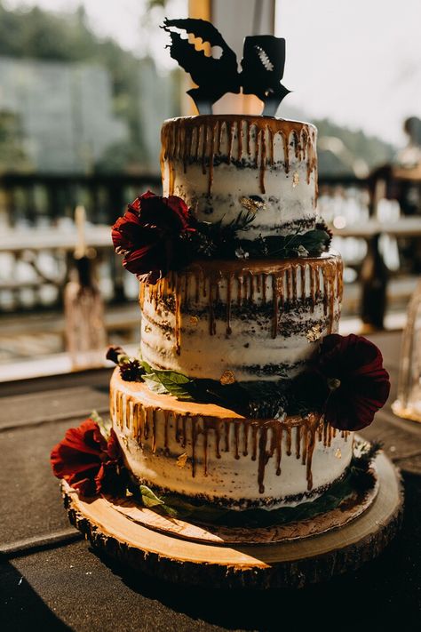 A red velvet cake with golden dropped icing and a Frankenstein/Bride of Frankenstein topper. Halloween Wedding Cakes Simple, Frankenstein Wedding Theme, Bride Of Frankenstein Wedding, Frankenstein Wedding, Horror Wedding Cake, Horror Movie Wedding Cake, Frankenstein Wedding Cake, Frankenstines Bride, Vampire Wedding Cake Topper