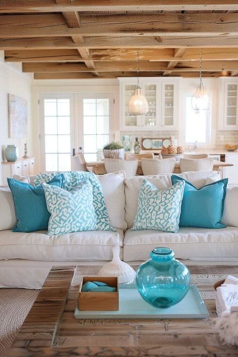 Discover stylish and inviting tan living room ideas to create a warm and versatile space. Explore color palettes, furniture options, and decor accessories that complement the sophisticated neutral tone of tan. Find inspiration for your perfect tan living room design. Tan And Turquoise Living Room, Brown Couch Coastal Living Room, Coastal Living Rooms Tan Couch, Neutral Palette Beach Stylore Furniture And Living Room, Coastal Living Rooms Brown Couch, Tan Couch Living Room, Tan Living Room, Coastal Kitchen Decor, Coastal Room