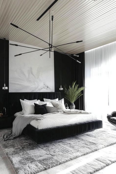 Turn your bedroom into your dream space with these 25 stunning black and silver bedroom ideas. Explore the versatility of this color combination to create a space that's both stylish and inviting. From dramatic statement pieces to subtle accents, these ideas will inspire you to create a bedroom that's both functional and aesthetically pleasing. Embrace the allure of black and silver and transform your bedroom into a luxurious sanctuary. Black Accent Bedroom Ideas, Black Silver White Bedroom, Black And Charcoal Bedroom, Black Platform Bedroom Ideas, Black Silver Bedroom Ideas, Contemporary Bedroom Black, Modern Bedroom Black And White, Black Velvet Bed Bedroom Ideas, Black Silver Bedroom