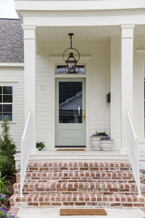 Exterior Door Transom, Cottage Front Exterior, Renovated Cottage Exterior, Exterior Door No Window, Single Front Door With Transom, Tan House With Blue Door, Exterior Door With Transom Window, Exterior House Colors Single Story, Exterior Lanterns Front Door