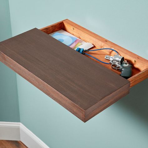 A Shelf with a Secret Secret Hiding Places, Hidden Compartments, Secret Storage, Into The Wood, Floating Shelves Diy, Wood Floating Shelves, Estantes Flotantes, Hiding Places, Living Room Tv Wall