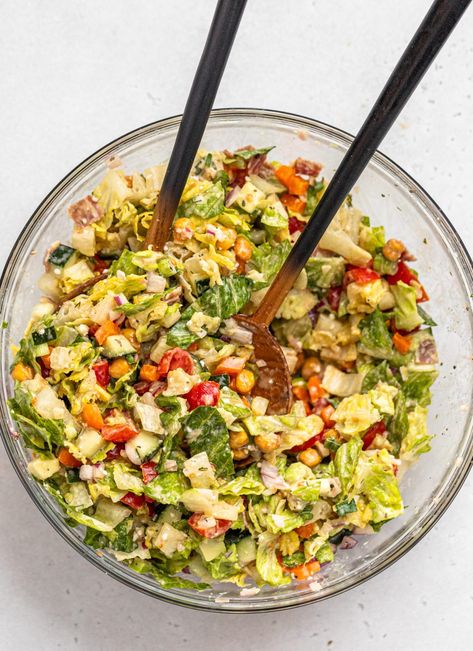 A large glass mixing bowl full of chopped salad. Chopped Salad Recipe, Tahini Dressing Recipe, Chopped Salad Recipes, Salad With Lemon, Lemon Tahini Dressing, French Fried Onions, Tahini Dressing, Chopped Salad, Romaine Lettuce