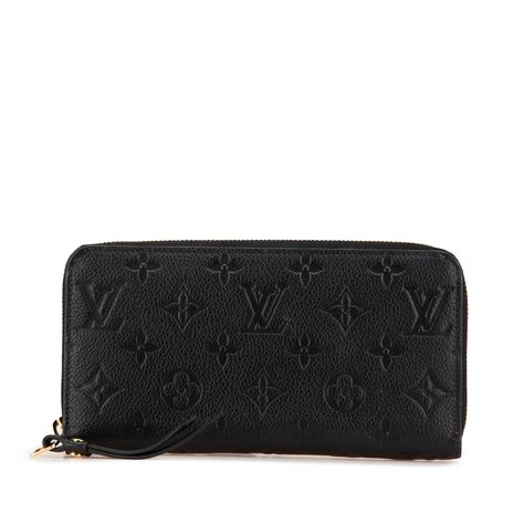 Product Details: Black Louis Vuitton Monogram Empreinte Zippy Long Wallet. This long wallet features a monogram empreinte leather body, a zip around closure, and interior zip and slip pockets. 3.9" L x 7.7" W x 1" D. Condition: Pre-owned. Good. Exterior Back stained with Other. Exterior Corners Worn. Exterior Handle Cracked. Interior Pocket Scratched, Worn. Interior Lining Scratched, Worn. Interior Lining stained with Other. Practical Attachment Scratched. Zipper Rusty/Tarnished, Scratched. Please note this is a pre-owned item that may display signs of wear consistent with the condition listed above and shown in photos. Designer Revival guarantees this is an authentic Black Louis Vuitton Monogram Empreinte Zippy Long Wallet or 100% of your money back. Learn more about our authentication pr