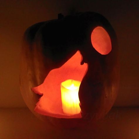 Howling wolf and full moon carved on the pumpkin. Pumpkin with candle inside in the dark. Wolf Pumpkin, Dried Sunflowers, Candle In The Dark, Moon Full, Pumpkin Carving Designs, Pumpkin Carvings Stencils, Howling Wolf, Halloween Pumpkins Carvings, Wolf Moon