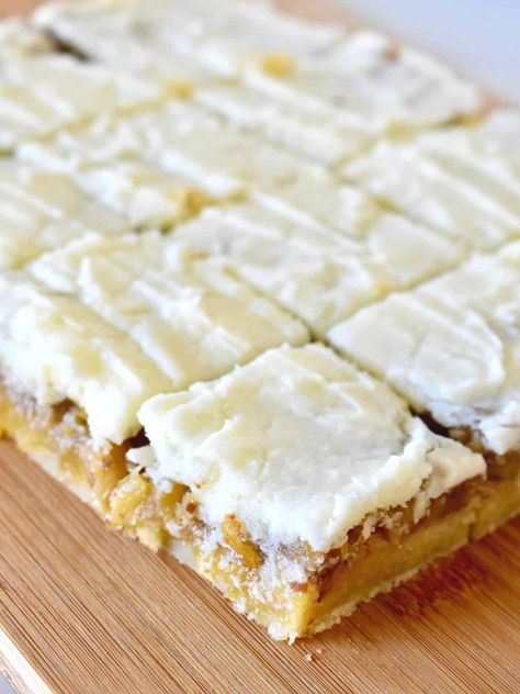 Pineapple Bars are made with a shortbread base, pineapple pecan middle, and delicious pineapple icing. Don't miss tasty recipe that is full of tropical flavor and is so easy to make! Pineapple Bliss Bars Recipe, The Best Pineapple Bake, Pineapple Bars Recipe, Pineapple Icing, Pineapple Bars, Pineapple Squares, Pineapple Filling, Bliss Bars, Bliss Bar