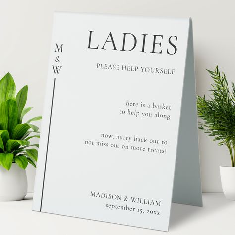 Enhance your restroom experience with our minimalist and stylish wedding bathroom tent sign. Designed to seamlessly blend into any modern wedding celebration. The customizable text style, colors, and sizes allow you to personalize it to your preferences and match your wedding decor flawlessly. This sign not only serves a practical purpose but also becomes a beautiful keepsake, preserving the memories of your special day for years to come. Bathroom Pedestal, Bathroom Basket Wedding, Bathroom Basket, Wedding Bathroom, Bathroom Baskets, Table Tents, Wedding Stationery Design, Sign Stand, Shop Wedding