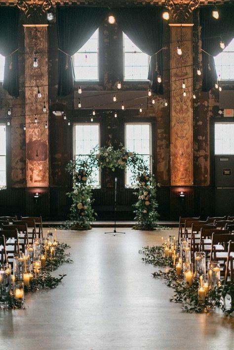 rustic loft wedding aisle decoration Moody Indoor Wedding Ceremony, Wedding Alter Floor Decor, Ceremony Venue Ideas, Dark Wedding Ceremony Aesthetic, Indoor Alter Ideas, Wedding In Old Building, Urban Wedding Ceremony, Smilax Arch, Church Wedding Venue Ideas