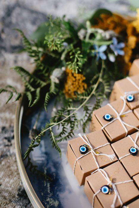 Greek Quinceanera Theme, Evil Eye Wedding Favor, Greek Wedding Theme, Evil Eye Wedding, Blue Goblets, Hippie Shop, Wedding Chocolate, Reception Tables, Greek Evil Eye