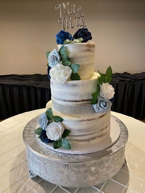 The couple chose beautiful blues to accent this half naked wedding cake made by our in-house baker! #wedding #weddingcake #halfnakedcake #inhousebaker #blue #flowers #rustic #theempressestate #woodlandchateau #woodlandwa Wedding Blue Flowers, Naked Cake Wedding, Blue Wedding Cake, Wedding Cakes Blue, Wedding Blue, Cake Wedding, The Empress, Blue Wedding