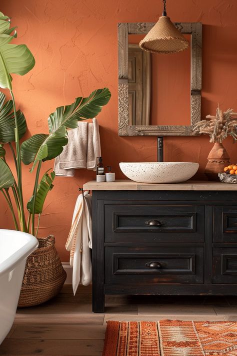 29 Afrohemian Decor Bathroom Ideas for a Culturally Rich Space 17 Afro Bohemian Style Decor Bathroom, Clay Color Bathroom, Terracotta And Black Bathroom, Warm Tone Bathroom Ideas, Terracotta And Green Bathroom, Bathroom Earth Tones, Glow Bathroom, Orange Bathroom Walls, Burnt Orange Bathroom