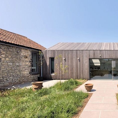 Mitchell Eley Gould turned an existing long low house-in-a-barn into a bedroom wing while a larch-clad extension created a new kitchen and living area Clad Extension, Barn Extension, Barn Conversion Exterior, Bungalow Extensions, Larch Cladding, Outside Room, Agricultural Buildings, Room Extensions, Wooden Barn