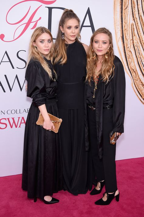 30 Years of Mary-Kate and Ashley Olsen Style Photos | W Magazine - They've now recruited a third — sister Elizabeth, for whom their Elizabeth & James line is named, is just as chic as her elder sisters.  Mary-Kate and Ashley Olsen with Elizabeth Olsen, all in The Row, at the CFDA Fashion Awards in New York, New York, June 2016 Olsen Sisters, Ashley Olsen Style, Olsen Fashion, Michelle Tanner, Olsen Twins Style, Olsen Sister, Cfda Fashion Awards, Style Transformation, Mary Kate Ashley