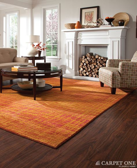 Orange is unexpected in this space. It really works well with the dark hardwood floors. Rug from Oriental Weavers' Expressions Collection. Pantone Universe, Orange Carpet, Living Room Orange, Dark Wood Floors, Floor Area Rugs, Inviting Home, Yellow Area Rugs, Orange Area Rug, Beautiful Living Rooms